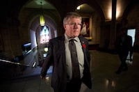 Conservative Sen. Don Plett arrives at the Senate on Parliament Hill in Ottawa on Monday, October 28, 2013. Conservative senator Plett is looking for the Liberal government to enact "prompt payment" legislation on federal projects, making sure cash paid to large construction firms flows without delay to the trade contractors doing the work.THE CANADIAN PRESS/Sean Kilpatrick