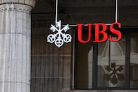 (FILES) A sign and logo of the Swiss giant banking UBS is seen in Lausanne on February 6, 2024. On May 7, 2024, banking giant UBS reported quarterly earnings well ahead of expectations thanks to cost-cutting and revenue growth, returning to profit territory after two quarters in the red. (Photo by Fabrice COFFRINI / AFP) (Photo by FABRICE COFFRINI/AFP via Getty Images)