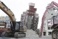A building is seen partially collapsed, two days after a powerful earthquake struck the city, in Hualien City, eastern Taiwan, Friday, April 5, 2024. Rescuers searched Thursday for missing people and worked to reach hundreds stranded when Taiwan's strongest earthquake in 25 years sent boulders and mud tumbling down mountainsides, blocking roads. (AP Photo/Chiang Ying-ying)