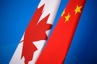 Flags of Canada and China are shown in Beijing, China, Monday, Nov. 12, 2018. The former CEO of the Pierre Elliott Trudeau Foundation says she resigned because some members of the board refused to recuse themselves for an independent forensic audit into a 2016 donation that she says was linked to China. THE CANADIAN PRESS/Jason Lee/Pool Photo via AP
