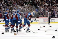 DENVER, COLORADO - APRIL 28: Hats liter the ice after Valeri Nichushkin #13 of the Colorado Avalanche scores his third goal against the Winnipeg Jets in the third period during Game Four of the First Round of the 2024 Stanley Cup Playoffs at Ball Arena on April 28, 2024 in Denver, Colorado.   (Photo by Matthew Stockman/Getty Images)