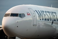 A WestJet Airlines Boeing 737 Max aircraft taxis to a gate after arriving at Vancouver International Airport in Richmond, B.C., Thursday, Jan. 21, 2021. The B.C. Court of Appeal has rejected WestJet's efforts to overturn the certification of a class-action lawsuit on baggage fees. THE CANADIAN PRESS/Darryl Dyck