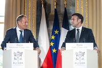French President Emmanuel Macron, right, and Poland's Prime Minister Donald Tusk deliver a statement to the media as part of their meeting at the Elysee Palace in Paris, Monday, Feb. 12, 2024. Tusk was traveling to Paris and Berlin in a diplomatic effort to rebuild key alliances as fears grow that former President Donald Trump could return to power in the United States and give Russia a free hand to expand its aggression in Europe. (Christophe Petit-Tesson/Pool Photo via AP)