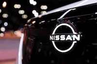 FILE PHOTO: A Nissan logo is seen in a vehicle during the press day at the Los Angeles Auto Show in Los Angeles, California, U.S. November 17, 2022. REUTERS/Mike Blake