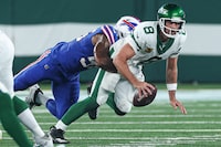 FILE PHOTO: Sep 11, 2023; East Rutherford, New Jersey, USA; New York Jets quarterback Aaron Rodgers (8) is injured while being sacked by Buffalo Bills defensive end Leonard Floyd (56) during the first half at MetLife Stadium. Mandatory Credit: Vincent Carchietta-USA TODAY Sports/File Photo