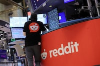 A trader wears a t-shirt with Reddit's logo, at the New York Stock Exchange (NYSE) in New York City, U.S., March 21.
