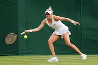 LONDON, ENGLAND - JULY 03: Kateryna Baindl of Ukraine plays a forehand against Leylah Fernandez of Canada on day one of The Championships Wimbledon 2023 at All England Lawn Tennis and Croquet Club on July 03, 2023 in London, England. (Photo by Michael Regan/Getty Images)