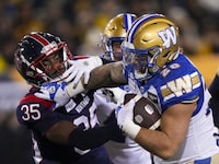 Winnipeg Blue Bombers running back Brady Oliveira said Tuesday that his agent is talking to NFL teams to try to get him workouts, parlaying the personal success he had this CFL season into achieving another dream.&nbsp;Oliveira (20) scores a touch down as he stiff arms Montreal Alouettes defensive back Reggie Stubblefield (35) during the first half of football action at the 110th CFL Grey Cup in Hamilton, Ont., Sunday, Nov. 19, 2023. THE CANADIAN PRESS/Nathan Denette