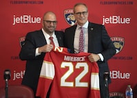FILE - Paul Maurice, right, is introduced as the new head coach of the Florida Panthers by general manager Bill Zito, during an NHL hockey news conference at FLA Live Arena, Thursday, June 23, 2022, in Sunrise, Fla. Florida Panthers general manager Bill Zito has his team in position to have the best record in the NHL for the second time in three years. And his four seasons in Florida have arguably been the best four-year run in team history. (AP Photo/Jim Rassol, File)