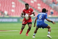 Canada’s Matt Oworu attacks the Samoa defence on Day 3 of the HSBC SVNS in Singapore in a Sunday, May 5, 2024, handout photo. THE CANADIAN PRESS/HO-World Rugby, KLC fotos, Mike Lee, *MANDATORY CREDIT*