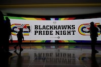A big screen shows "Blackhawks Pride Night," before an NHL hockey game between the Vancouver Canucks and the Chicago Blackhawks in Chicago, Sunday, March 26, 2023. (AP Photo/Nam Y. Huh)