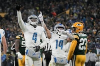 Detroit Lions wide receiver DJ Chark (4) and wide receiver Amon-Ra St. Brown (14) celebrate as Green Bay Packers cornerback Jaire Alexander (23) watches after Chark caught a pass for a first down late in the second half of an NFL football game Sunday, Jan. 8, 2023, in Green Bay, Wis. (AP Photo/Morry Gash)