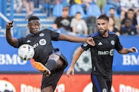 CF Montréal has signed midfielder Victor Wanyama to a two-year contract extension through the 2024 Major League Soccer season. Wanyama takes a shot on goal as teammate Rudy Camacho looks on during first half MLS soccer action against Toronto FC in Montreal, on July 16, 2022. THE CANADIAN PRESS/Graham Hughes