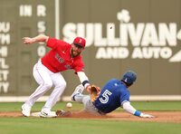Mar 3, 2024; Fort Myers, Florida, USA; Toronto Blue Jays second baseman Santiago Espinal (5) sides safe into second base as Boston Red Sox shortstop Trevor Story (10) attempted  to tag him out during the fourth inning  at JetBlue Park at Fenway South. Mandatory Credit: Kim Klement Neitzel-USA TODAY Sports