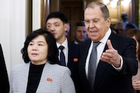 Russian Foreign Minister Sergey Lavrov, right, and North Korean Foreign Minister Choe Son Hui enter a hall for their talks in Moscow, Russia, Tuesday, Jan. 16, 2024. (Maxim Shemetov/Pool Photo via AP)
