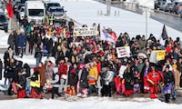 Family and supporters walk from Portage and Main to the Manitoba legislature to protest the provincial government's delay in searching a landfill for missing indigenous women, Friday, March 8, 2024. THE CANADIAN PRESS/John Woods