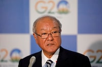 FILE PHOTO: Japanese Finance Minister Shunichi Suzuki speaks with the media after a meeting of G7 leaders on the sidelines of G20 finance ministers' and Central Bank governors' meeting at Gandhinagar, India, July 16, 2023. REUTERS/Amit Dave/File Photo