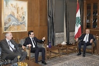 French Foreign Minister Stephane Sejourne, center, meets with Parliament Speaker Nabih Berri, right, in Beirut, Sunday, April 28, 2024. (AP Photo/Hassan Ammar)