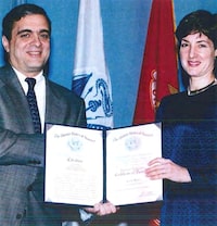 An undated handout image from a U.S. Department of Defense report dating back to 2005 shows Ana Belen Montes receiving a national intelligence certificate of distinction from George Tenet, who served as Director of Central Intelligence (DCI) for the United States Central Intelligence Agency. U.S. Department of Defense/Handout via REUTERS    THIS IMAGE HAS BEEN SUPPLIED BY A THIRD PARTY