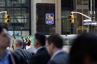 RBC bank logo standing out among the crowed and car traffic on Bay Street during rush hour, photographed in downtown Toronto, photographed on  May 24, 2023  (Ammar Bowaihl/The Globe and Mail)