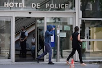 The passenger of the car driven by 17-year-old Nahel M. who was killed by police during a traffic stop, leaves after he attended a hearing at a police station housing a branch of France's National Police General Inspectorate - IGPN) in Paris, on July 3, 2023. The killing of Nahel M, has revived longstanding accusations of institutional racism within the French police, which rights groups say single out minorities during stops. (Photo by JULIEN DE ROSA / AFP) (Photo by JULIEN DE ROSA/AFP via Getty Images)