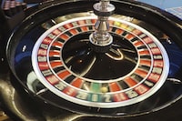 The operator of the Fallsview Casino Resort has been fined after Ontario's gaming regulator says it failed to flag a patron who brought tens of thousands of dollars in cash in a reusable grocery bag. A roulette wheel spins during a game at a casino on May 17, 2023. THE CANADIAN PRESS/AP-Wayne Parry