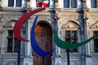 FILE - The logo of the Paris 2024 Paralympic Games is pictured in front of the Paris town hall, France, Friday, Nov. 10, 2017. Votes are taking place Friday, Sept 29, 2023, on whether to “partially suspend” Russia from the International Paralympic Committee. That could mean Russia sends competitors to the Paralympics in Paris next year but that they have to compete as neutral athletes without national symbols. (AP Photo/Christophe Ena, File)