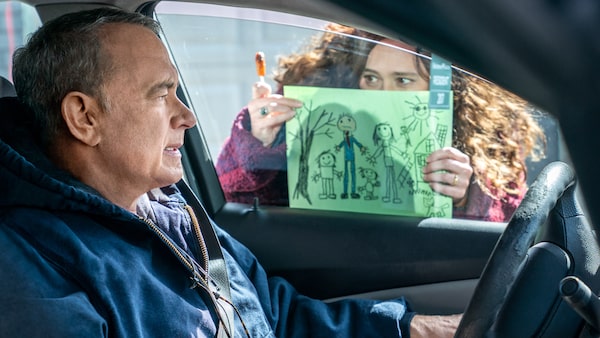 Otto (Tom Hanks) is loathe to react to the picture Marisol's (Mariana Treviño) kids drew in Columbia Pictures A MAN CALLED OTTO.