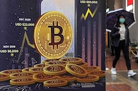 An advertisement for bitcoin cryptocurrency is displayed on a street in Hong Kong on Feb. 17, 2022.