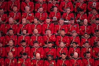 RCMP officers listen during a regimental funeral for RCMP Const. Rick O'Brien in Langley, B.C., on Wednesday, October 4, 2023. O'Brien, 51, was killed last month while executing a search warrant at a home in Coquitlam. THE CANADIAN PRESS/Darryl Dyck