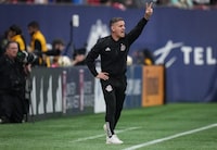 Toronto FC head coach John Herdman shouts instructions from the sideline during second half MLS soccer action against the Vancouver Whitecaps, in Vancouver on April 6, 2024. THE CANADIAN PRESS/Darryl Dyck