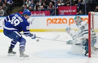 Toronto Maple Leafs forward William Nylander (88) tries to knock the puck out of the air as San Jose Sharks goaltender Mackenzie Blackwood (29) looks on during second period NHL hockey action in Toronto on Tuesday, January 9, 2024. THE CANADIAN PRESS/Nathan Denette