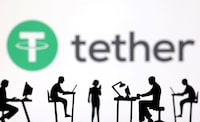 FILE PHOTO: Figurines with computers and smartphones are seen in front of Tether logo in this illustration taken, February 19, 2024. REUTERS/Dado Ruvic/Illustration/File Photo