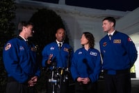 Artemis II crew members from left, Reid Wiseman, Victor Glover, Christina Hammock Koch, and Jeremy Hansen speak to members of the media outside the West Wing of the White House in Washington, Thursday, Dec. 14, 2023, after meeting with President Joe Biden. (AP Photo/Andrew Harnik)