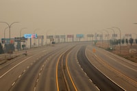 Empty highways are seen in West Kelowna, British Columbia, on August 20, 2023 as people are asked by authorities to stay off the roads as Creek fire continues to burn. With its lakes, mountains and endless rows of pine trees covered in a thick haze, the Canadian town of West Kelowna was on edge August 20, 2023 as residents either evacuated or prepared to do so. (Photo by Darren HULL / AFP) (Photo by DARREN HULL/AFP via Getty Images)