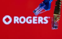 FILE PHOTO: Ethernet cables are seen in front of Rogers Communications logo in this illustration taken, July 8, 2022. REUTERS/Dado Ruvic/Illustrations/File Photo