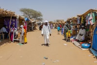 A man walks in the market of the Adre refugee camp, on April 10, 2024. Chad is home to the largest number of Sudanese refugees, nearly a million. In a year since the conflict in Sudan started between two rival factions of the military government, more than 571,000 have rushed there on foot or by mule, adding to more than 400,000 compatriots who fled the previous Darfur war since 2003. (Photo by Joris Bolomey / AFP) (Photo by JORIS BOLOMEY/AFP via Getty Images)