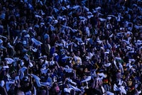 Fans wave towels before the Vancouver Canucks and Nashville Predators play Game 2 of an NHL hockey Stanley Cup first-round playoff series, in Vancouver, on Tuesday, April 23, 2024. THE CANADIAN PRESS/Darryl Dyck