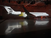 Bombardier's new logo is projected onto a Global 7500 aircraft during an unveiling ceremony at their plant Wednesday, April 24, 2024  in Montreal.THE CANADIAN PRESS/Ryan Remiorz