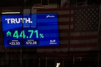 A screen displays trading information about shares of Truth Social and Trump Media & Technology Group, outside the Nasdaq Market site in New York City, U.S., March 26.