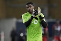 Toronto FC goalkeeper Sean Johnson applauds the fans following Canadian Championship quarterfinal soccer action against CF Montreal in Toronto on Tuesday, May 9, 2023. Toronto FC's nightmarish season took another turn for the worse Wednesday with news that Johnson will be out four to six weeks with a broken hand. THE CANADIAN PRESS/Chris Young