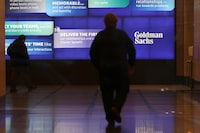 FILE PHOTO: People walk in the Goldman Sachs global headquarters in Manhattan, New York, U.S., November 15, 2021. REUTERS/Andrew Kelly/File Photo