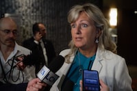 <p>Quebec Minister of Municipal Affairs Andree Laforest answers questions during a scrum in Saguenay on Thursday September 7, 2023. People who harass or threaten Quebec politicians could soon be hit with a court injunction or a fine of up to $1,500. &nbsp;THE CANADIAN PRESS/Francis Vachon.</p>
