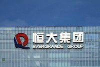FILE PHOTO: China Evergrande Group's logo is seen on its headquarters in Shenzhen, Guangdong province, China, Sept. 26, 2021. REUTERS/Aly Song/File Photo