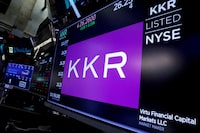 FILE PHOTO: Trading information for KKR & Co is displayed on a screen on the floor of the New York Stock Exchange (NYSE) in New York, U.S., August 23, 2018. REUTERS/Brendan McDermid/File Photo