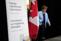 Commissioner Justice Marie-Josee Hogue makes her way on stage to deliver remarks on the interim report following its release at the Public Inquiry Into Foreign Interference in Federal Electoral Processes and Democratic Institutions, in Ottawa, Friday, May 3, 2024. THE CANADIAN PRESS/Adrian Wyld