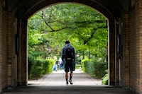 FILE PHOTO: People walk on the grounds of the University of Toronto in Toronto, Ontario, Canada September 9, 2020. Picture taken September 9, 2020. REUTERS/Carlos Osorio/File Photo