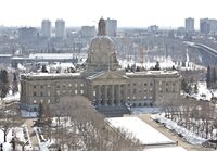 Unions representing sheriffs and RCMP officers are expressing dismay after the Alberta government announced it would bring functions currently carried out by peace officers under a new stand-alone police force. A view of the Alberta legislature in Edmonton is shown on Friday, March 28, 2014. THE CANADIAN PRESS/Jason Franson
