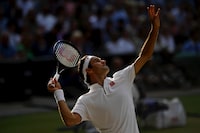 Roger Federer of Switzerland serves in his Men's Singles final at Wimbledon against Novak Djokovic of Serbia on July 14, 2019 in London, England.