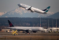 A new study will collect carbon emissions data from British Columbia's regional airports with the goal of getting all airports in the province to net-zero by 2030. Planes are seen at Vancouver International Airport, in Richmond, B.C., on March 20, 2020. THE CANADIAN PRESS/Darryl Dyck